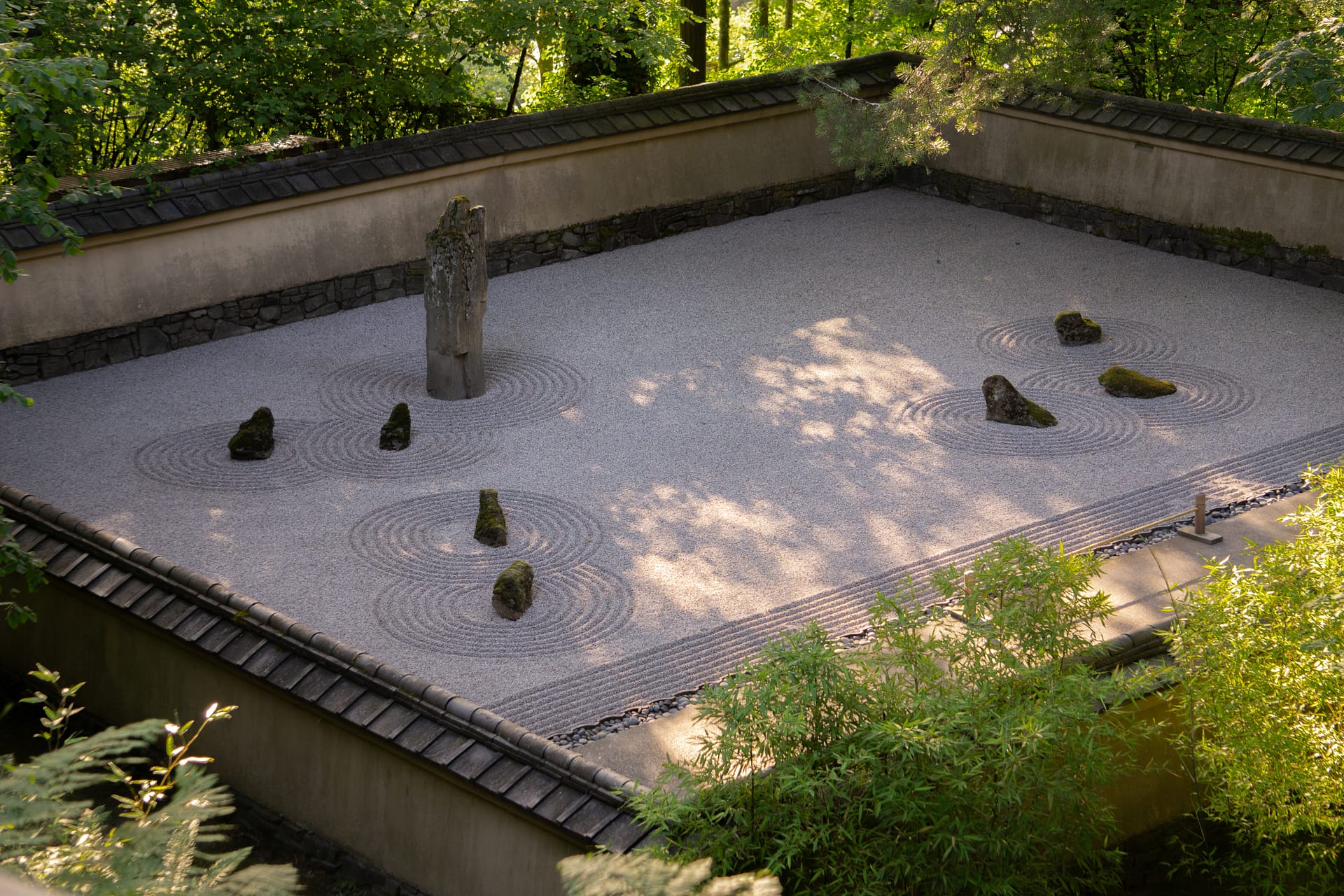 A raked gravel Japanese garden.