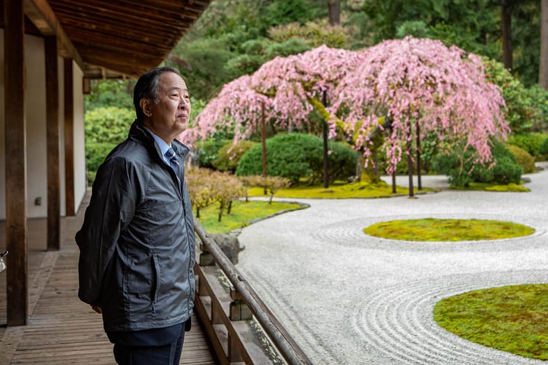 His Excellency, Ambassador Extraordinary and Plenipotentiary of Japan to the United States of America, Koji Tomita looks out at the Flat Garden. Photo by Jonathan Ley.