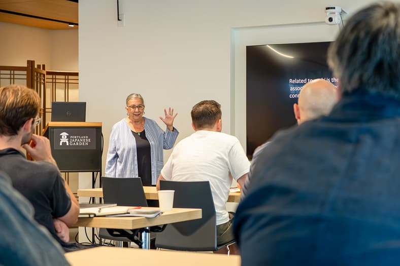 A person giving a lecture in a classroom.