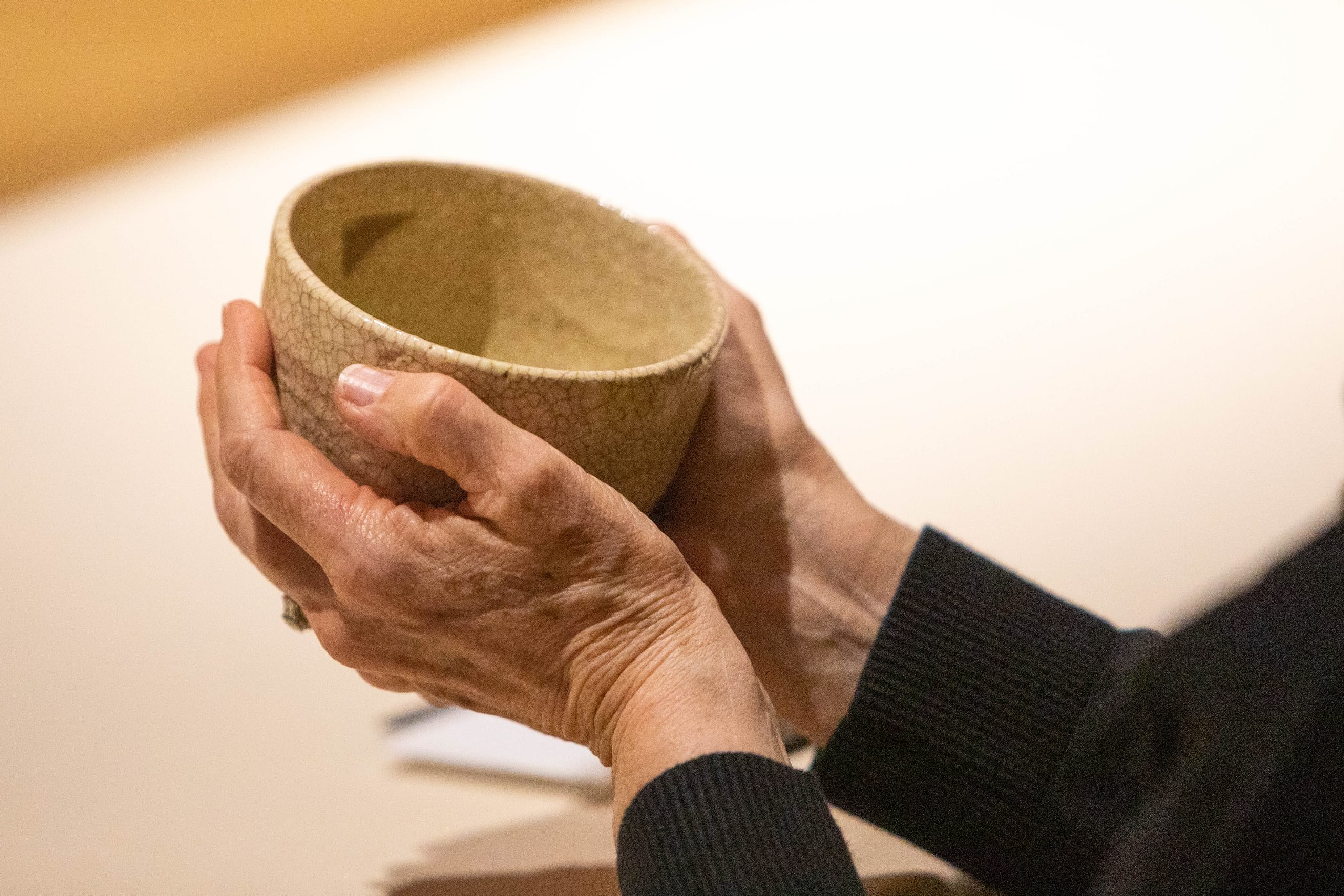 hands holding a tea bowl
