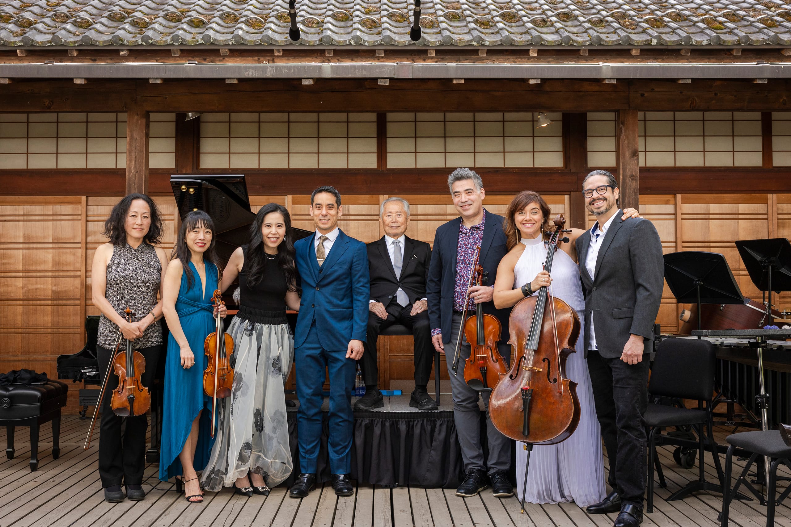 A group of musicians posing for a camera