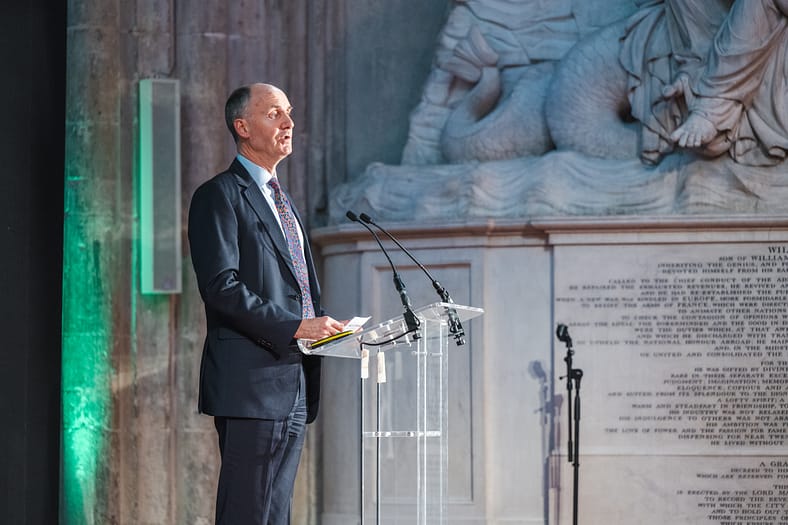 Richard Deverell speaking at a podiium.