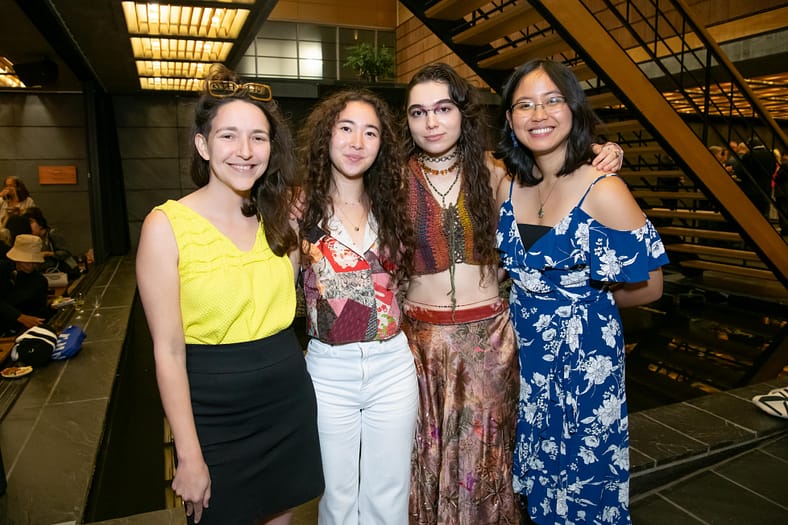 Four poets who participated in the New York Peace Symposium held by Japan Institute standing together in a photo.