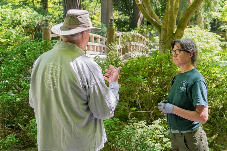 a man talking to a woman