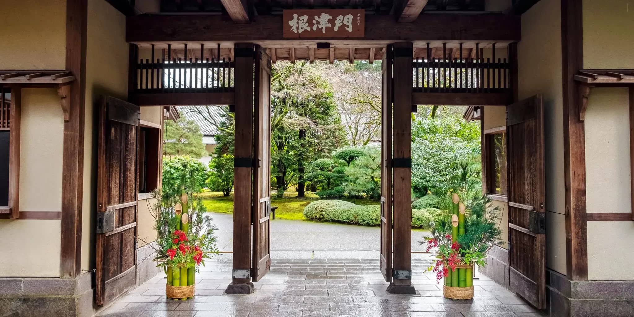 Japanese style building entrance with traditional kadomatsu arangments