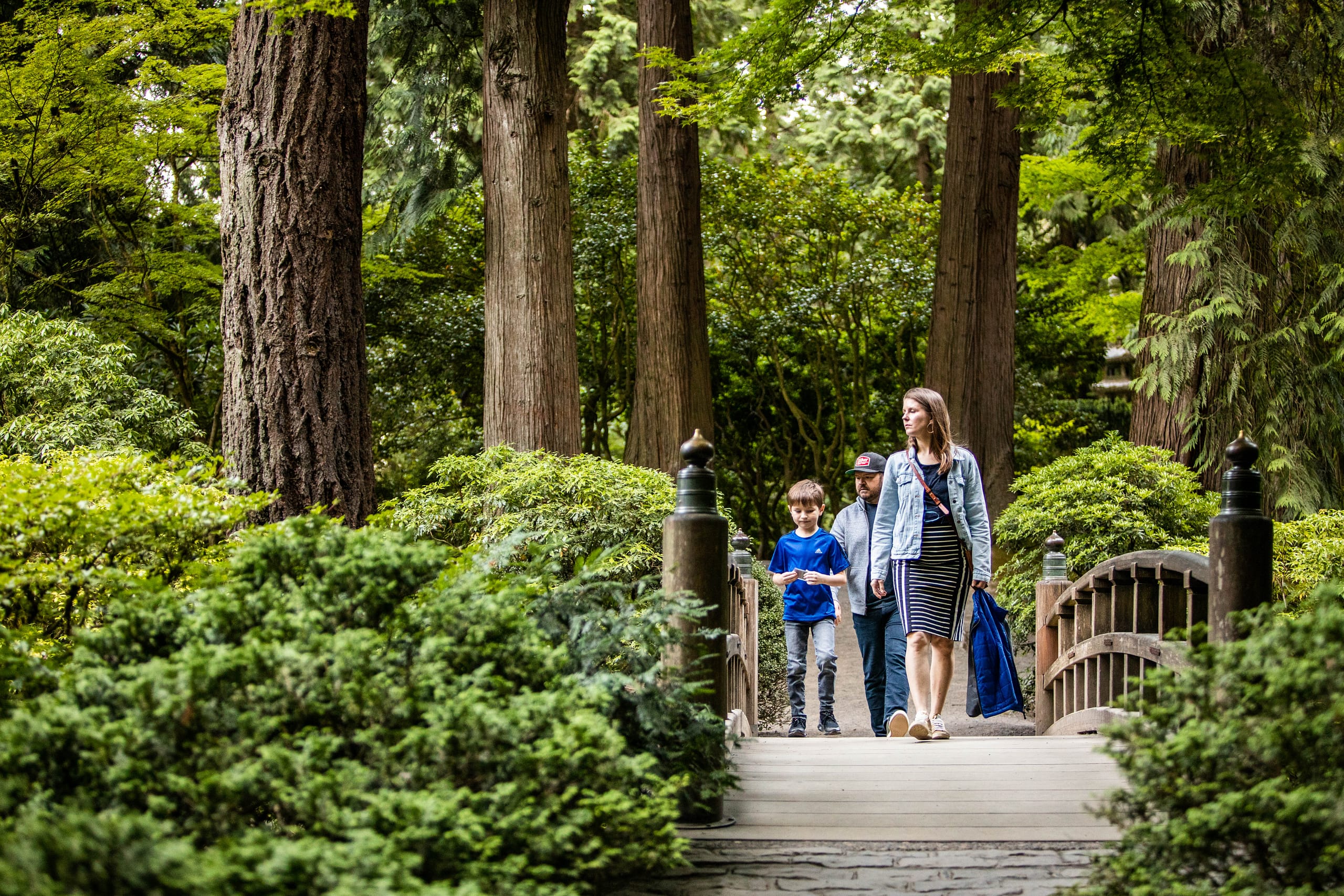 Couple sitting on a bench in the midst of the Japanese Garden