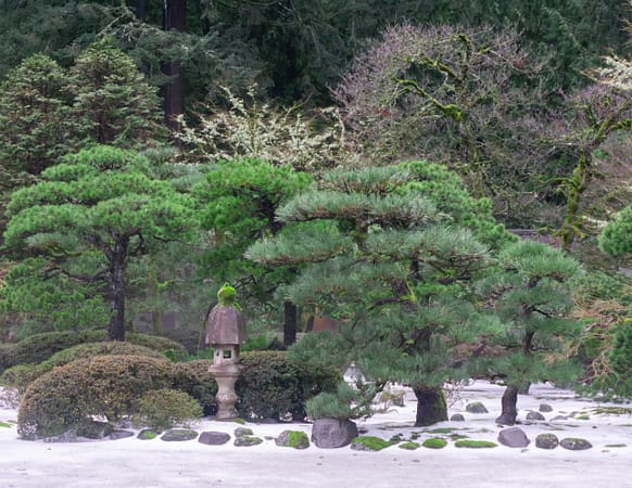 The Flat Garden of Portland Japanese Garden with snow on the ground.