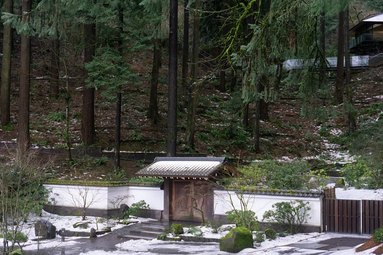 The Antique Gate, a wooden gate thought to be at least 200 years old that sits at the foot of the hill in Portland Japanese Garden.