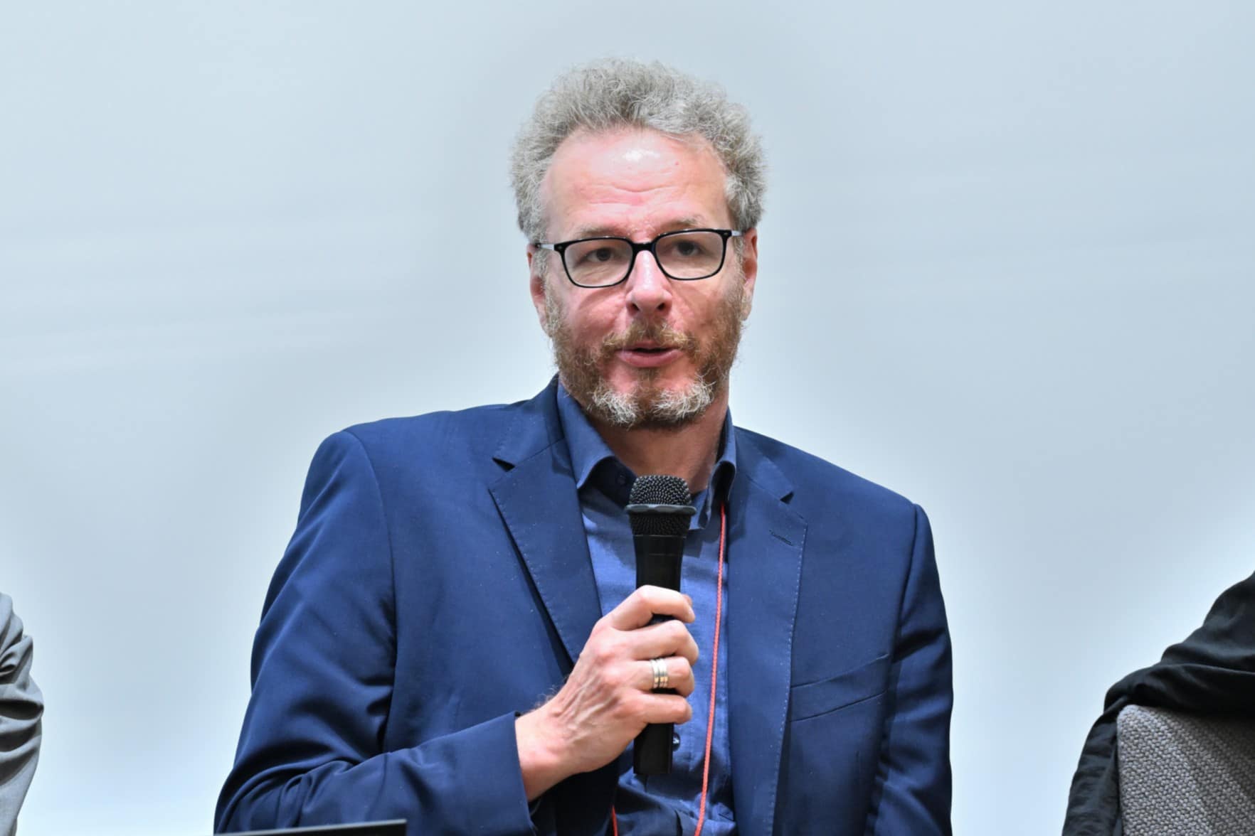 man speaking into a microphone