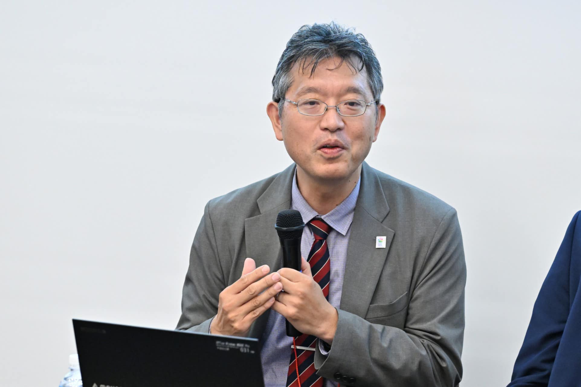 man speaking into a microphone