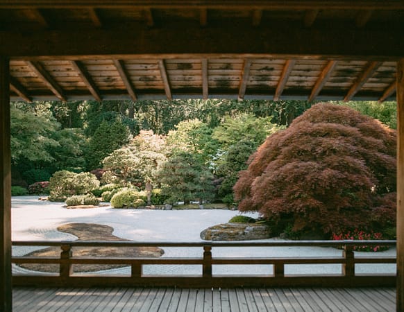 a raked gravel garden as seen from the deck of a pavilion