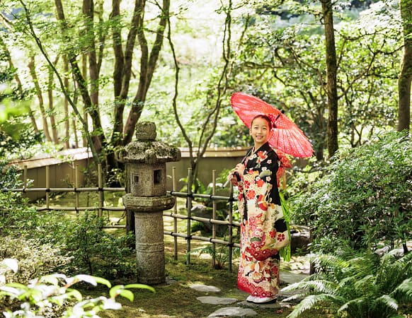 A girl in Kimono posing in the tea garden for Shichi Go San