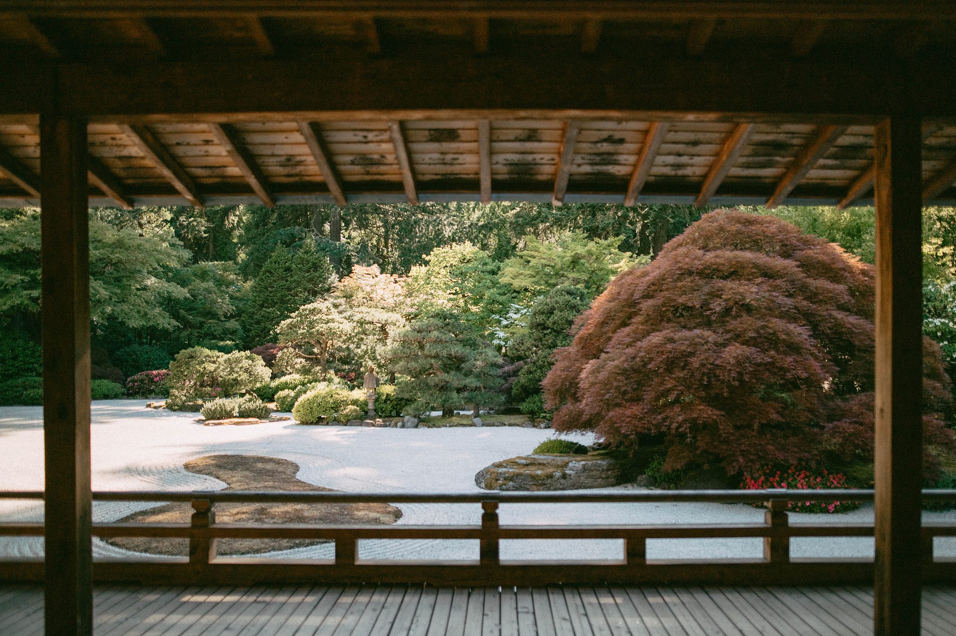 a raked gravel garden as seen from the deck of a pavilion