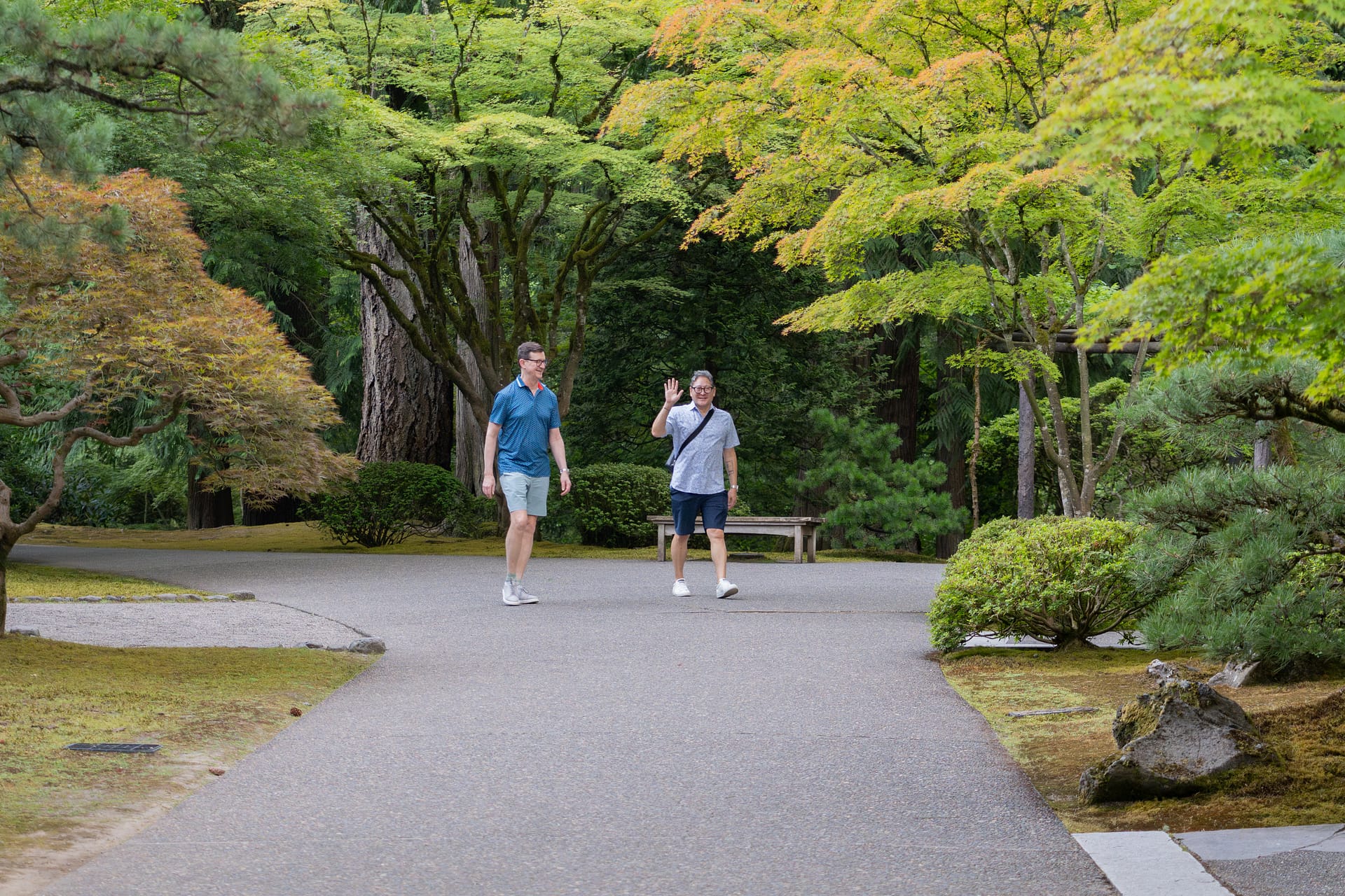 A couple walking down a garden path