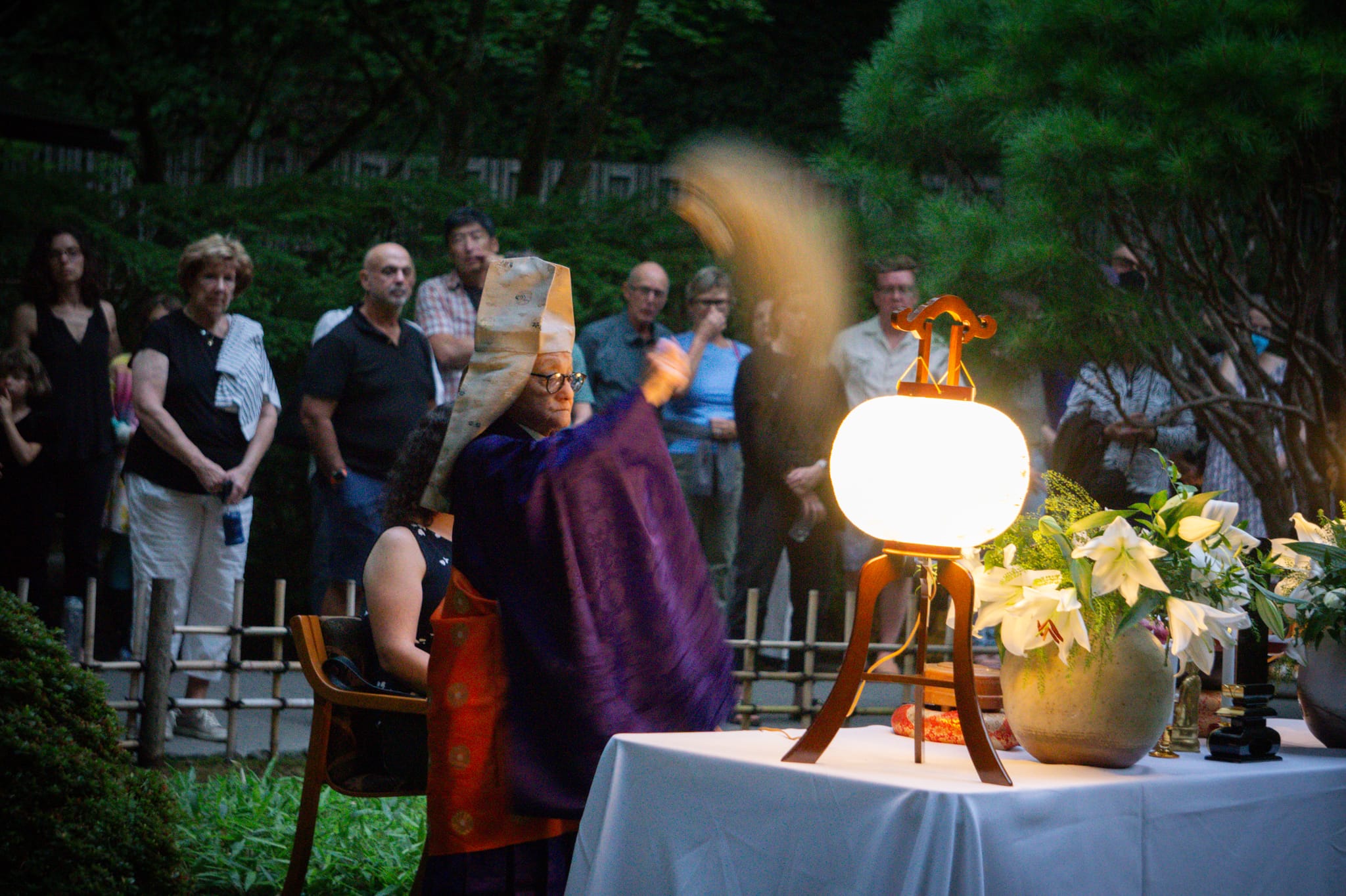 A Buddhist priest performs a ceremony in Portland Japanese Garden.