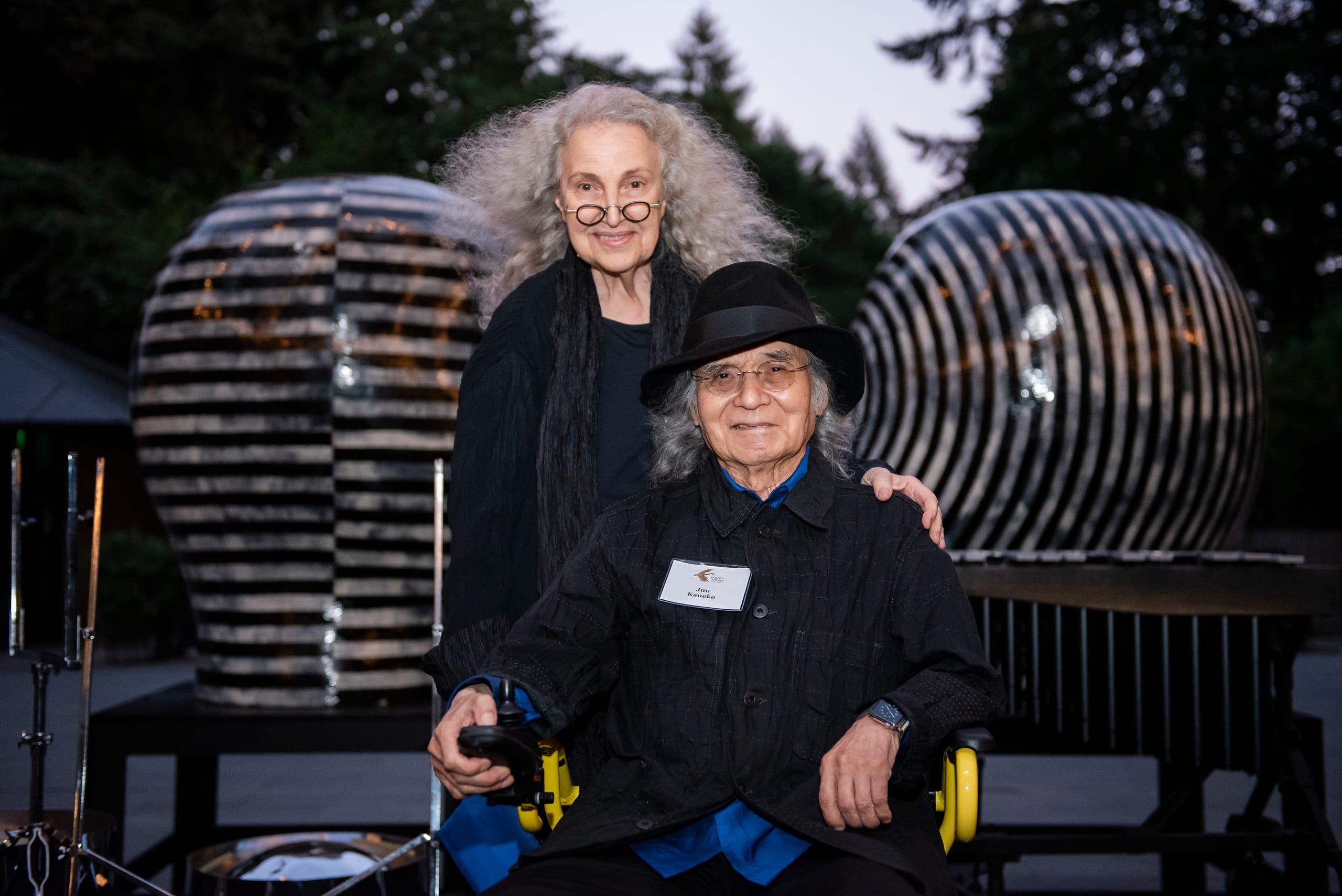 two people smiling for a camera