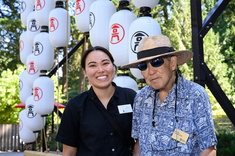 two people smiling for a camera