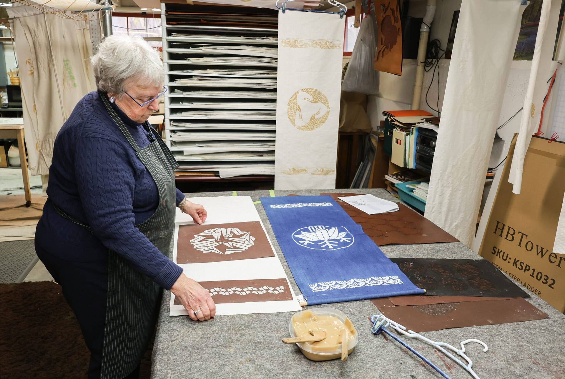 a woman with two pieces of fabric