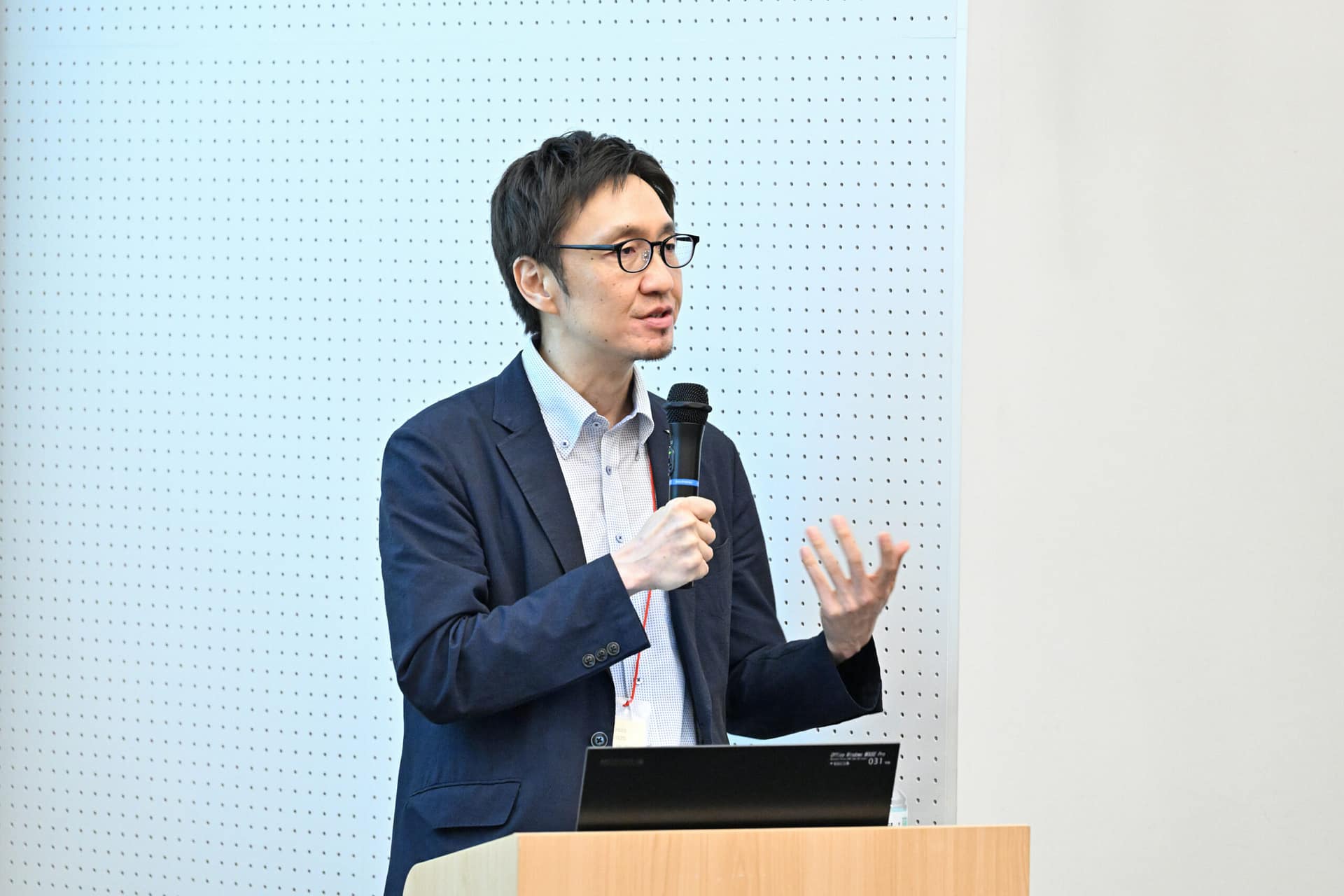 man speaking into a microphone