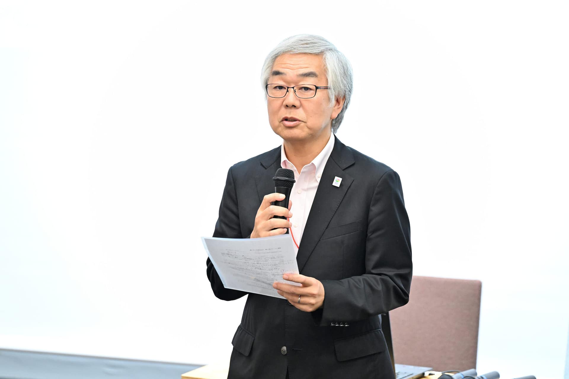 a man speaking into a microphone.