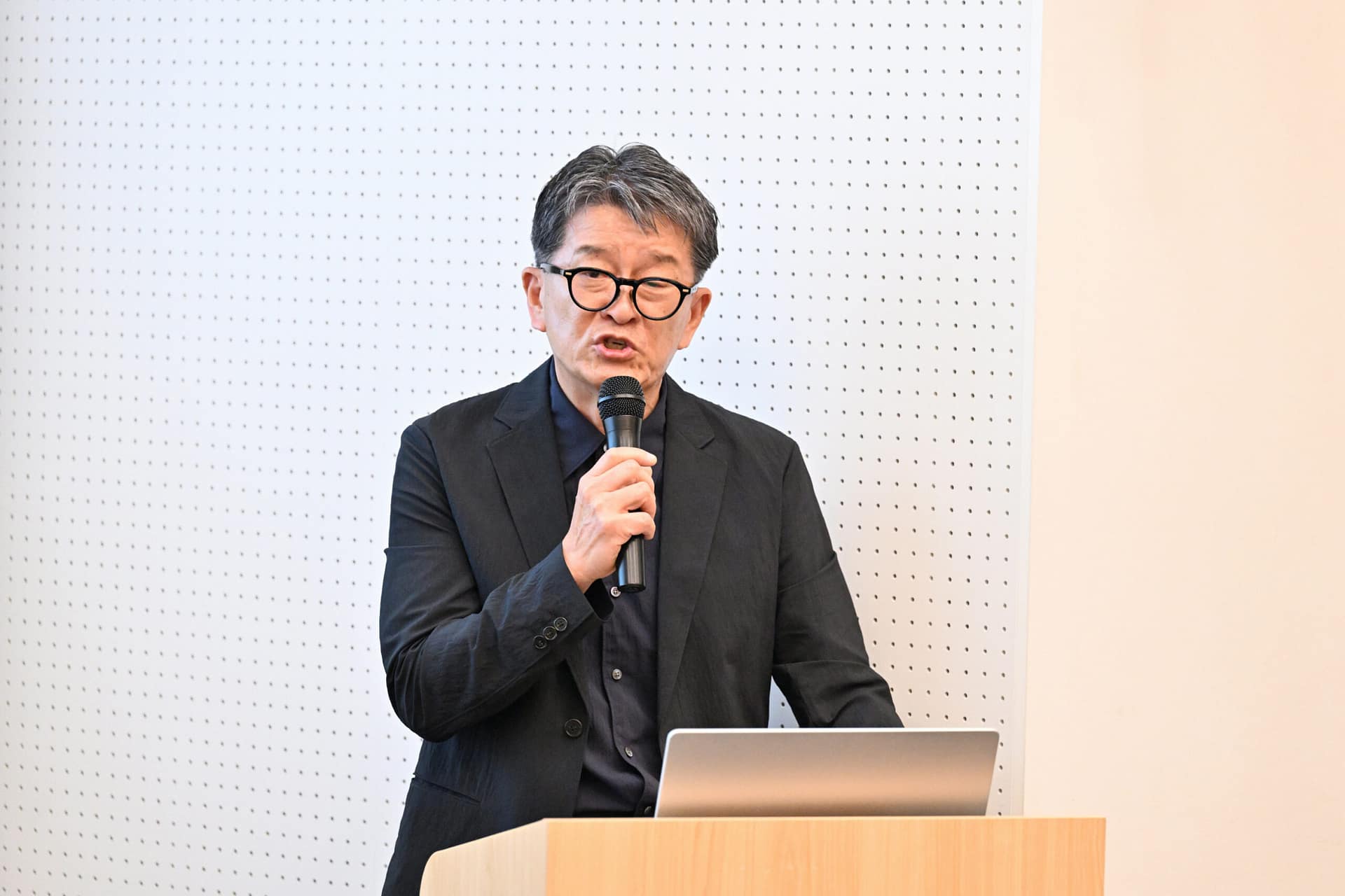 man speaking into a microphone