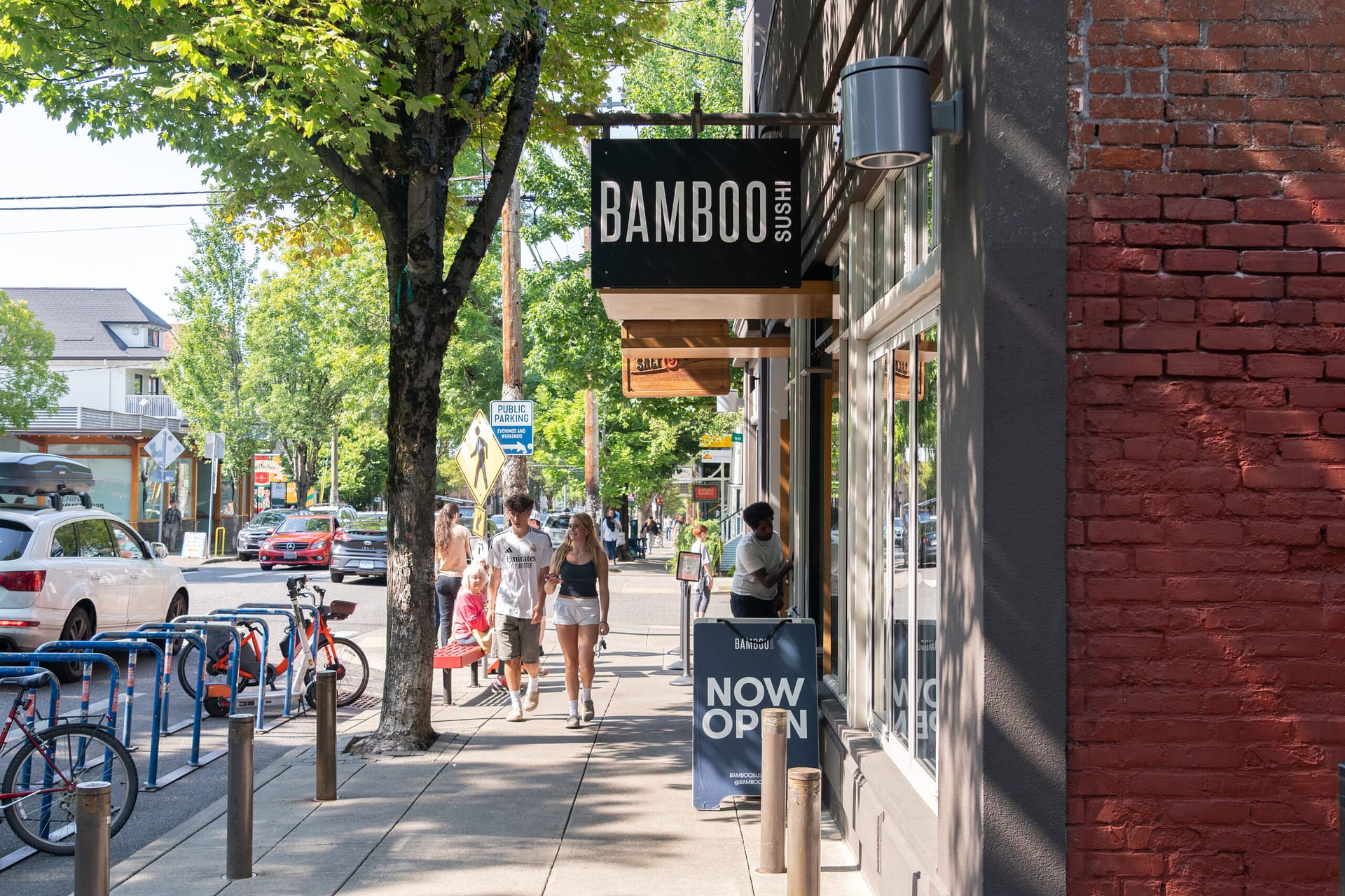A street exterior with a sign out front