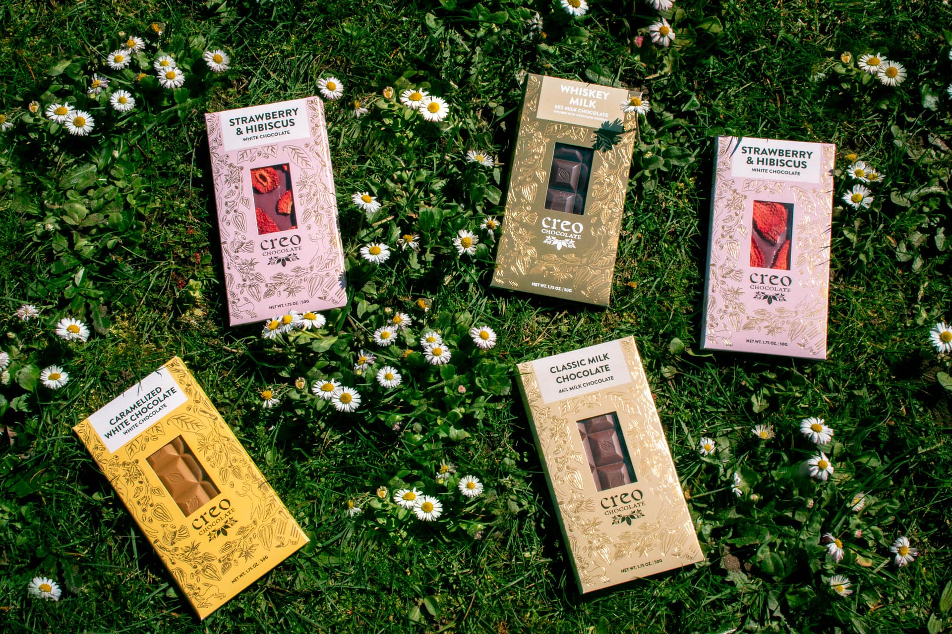 chocolate bars displayed on a bed of grass